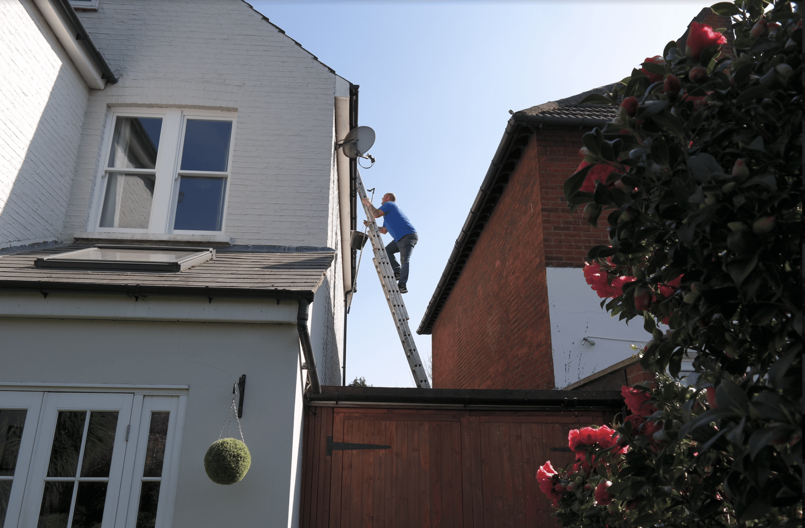 Man going to inspect a gutter for cleaning