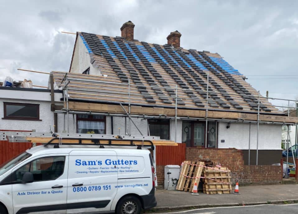 Sam's Gutters at work replacing a roof in Havering