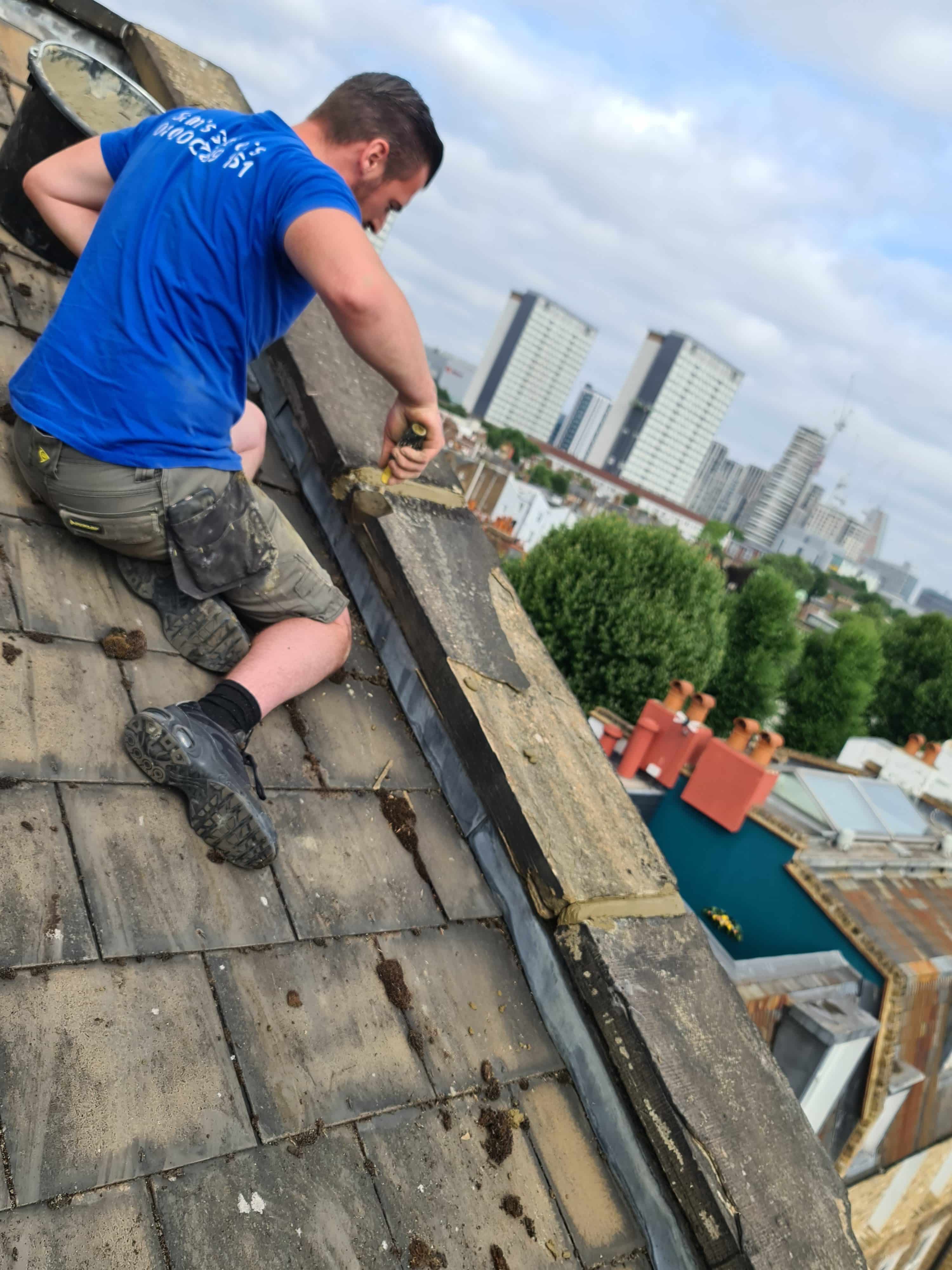 Man on roof doing roof repairs in Bromley