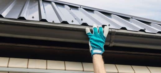 man replacing a gutter in Crystal Palace